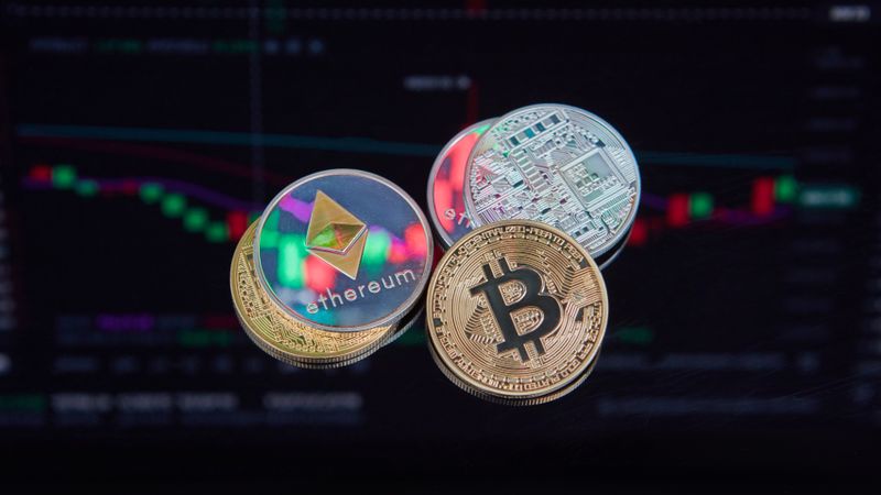 Floating Bitcoin and Ethereum coins with a market trend chart in the background symbolizing digital finance.
