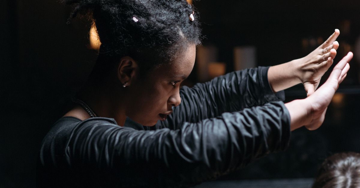 Female Ritualist A Woman in Black Long Sleeves Doing Rituals · Free Stock Photo