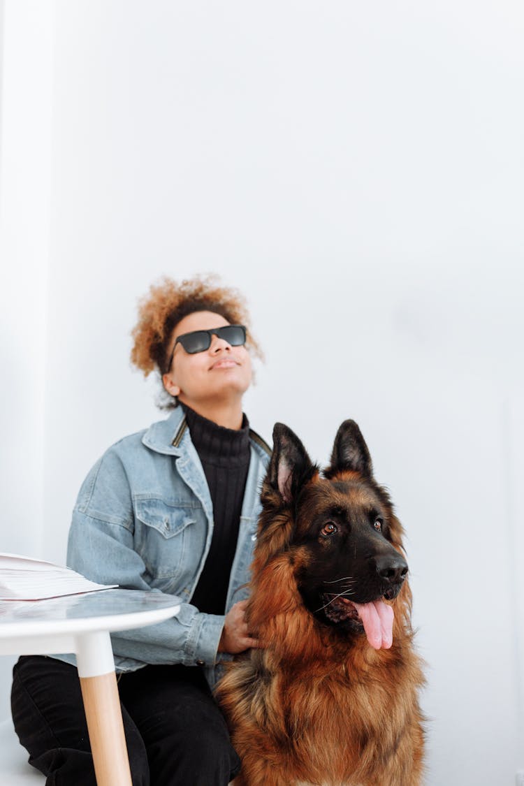 A Blind Woman Holding A Dog