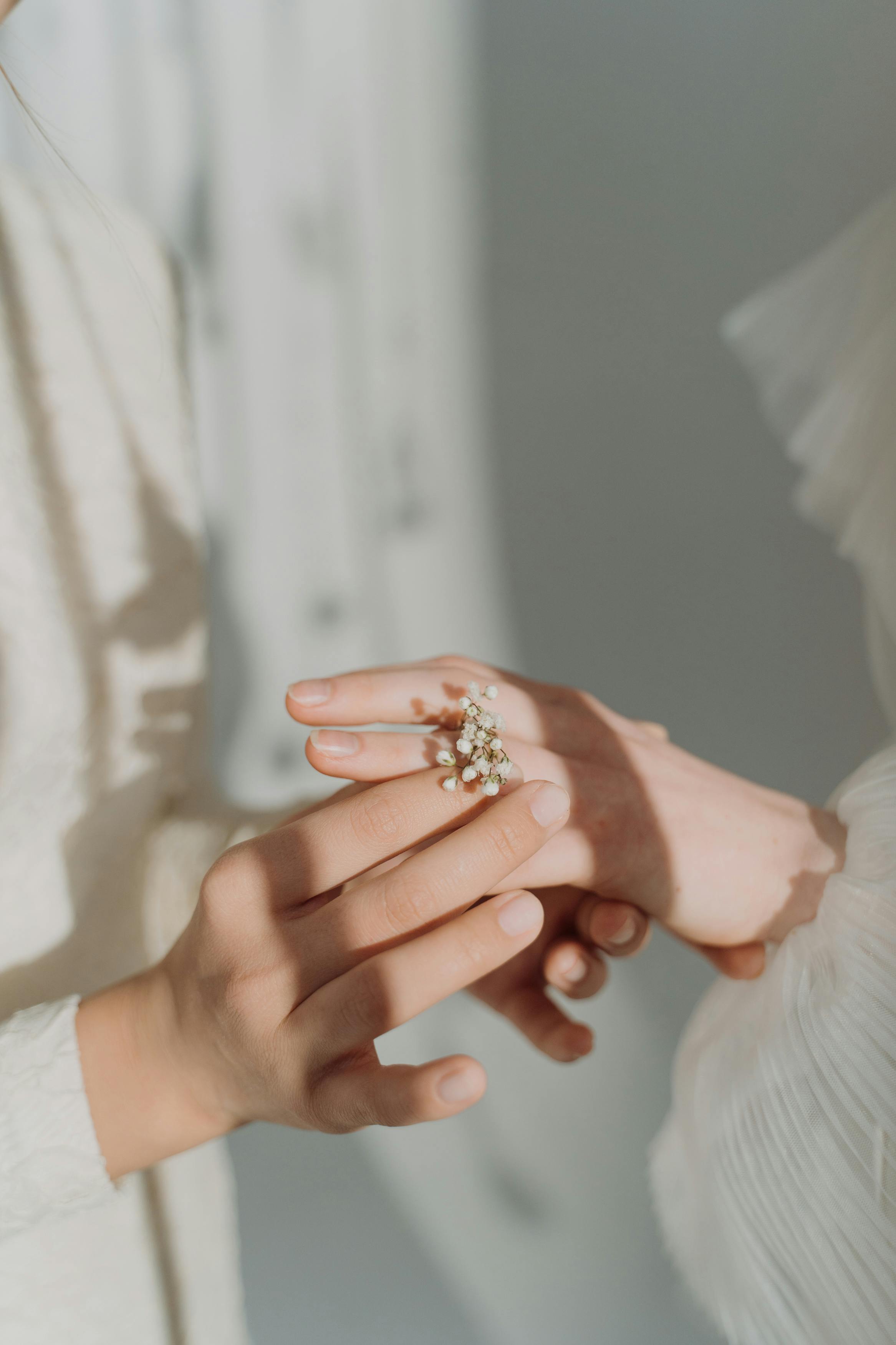 person wearing a floral design ring