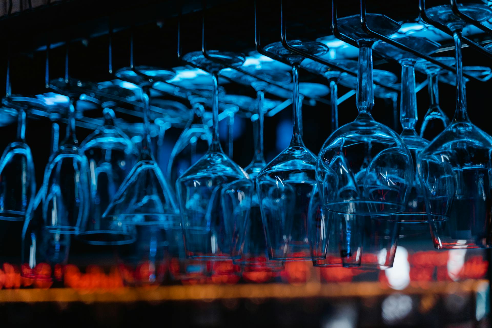 Glasses Hanging Upside Down in a Bar