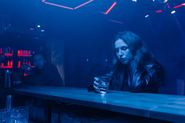 Man And Woman Drinking On The Bar