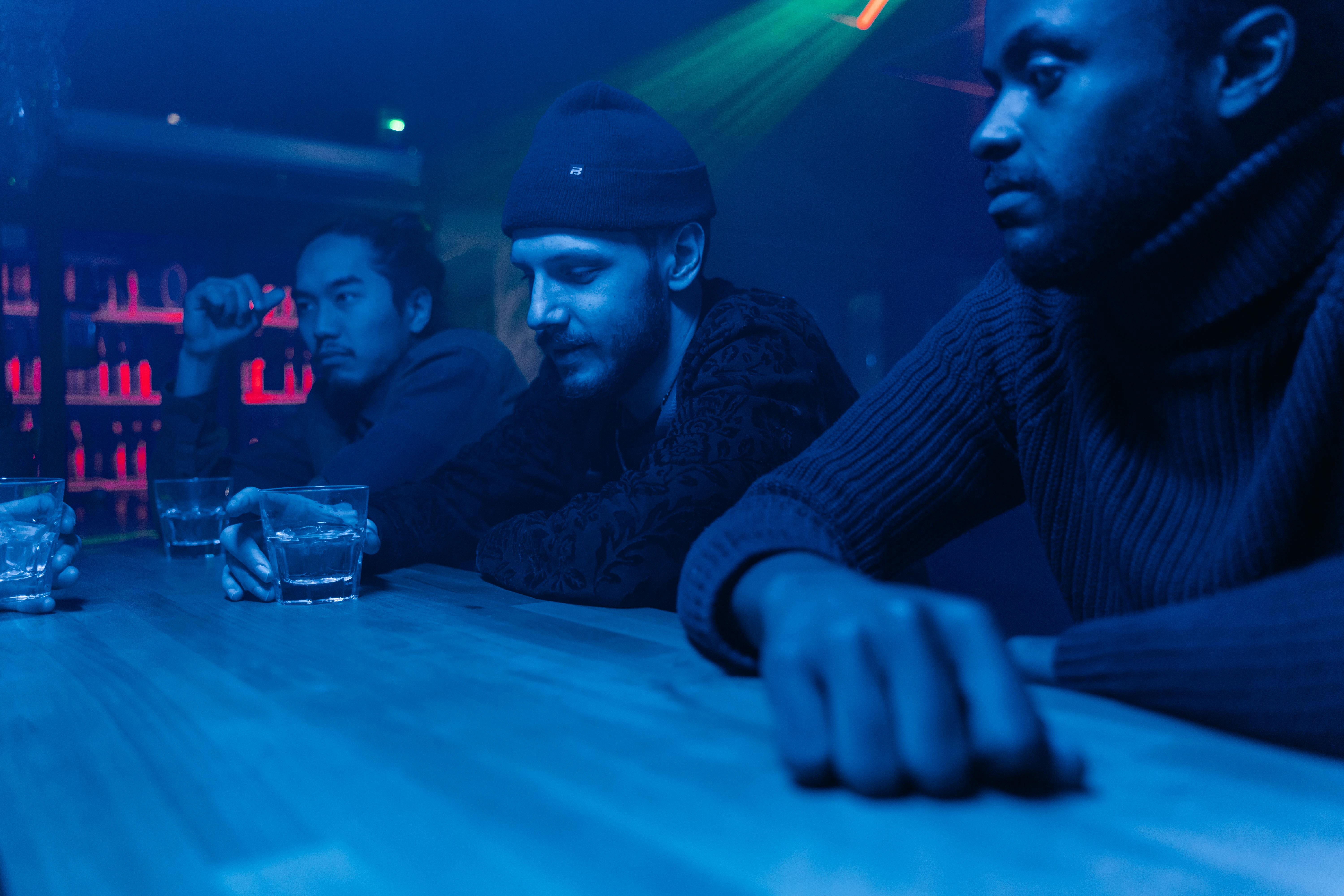 men drinking on the bar