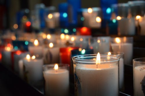Free Lit Intention Candles in the Church Stock Photo