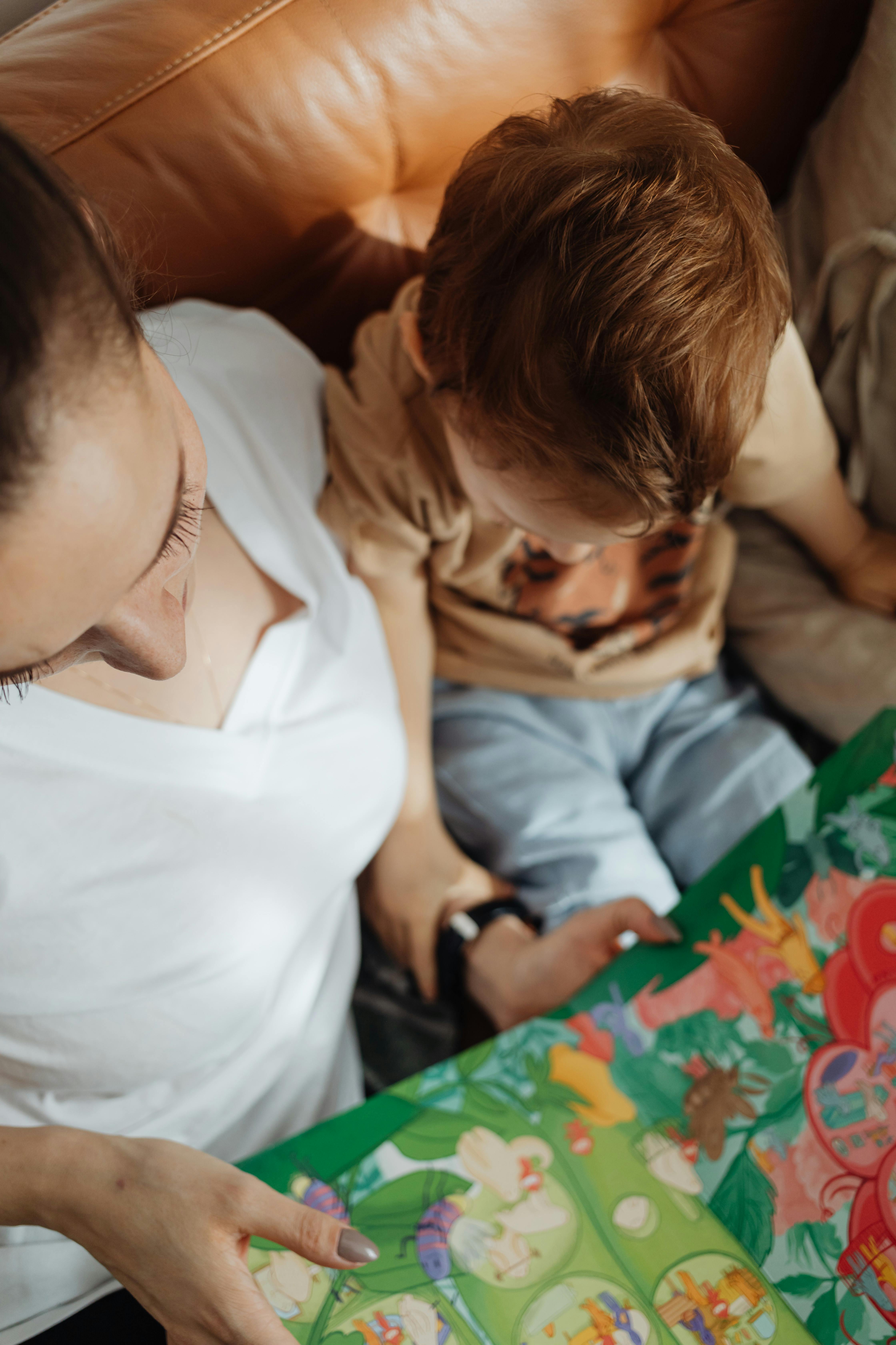 mother and child reading book together