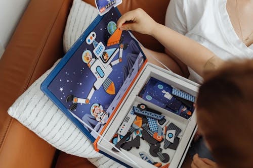 Close-up of Child Playing Game Puzzle