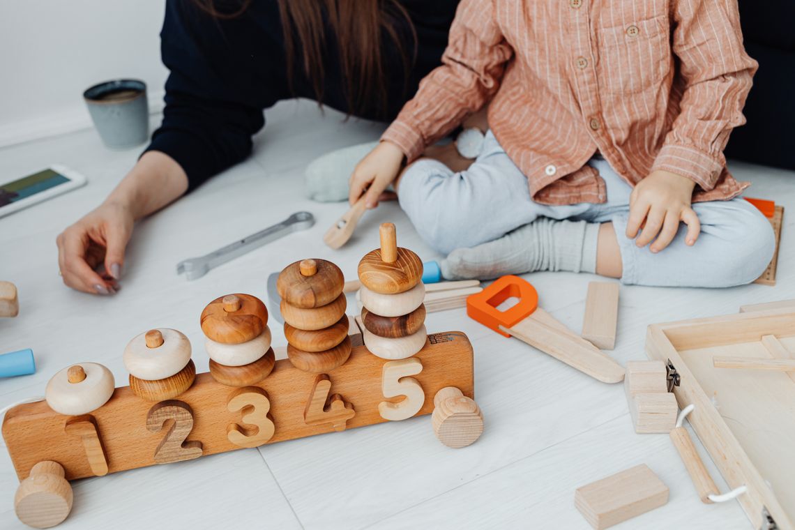 Child engaged in a hands-on educational activity at home