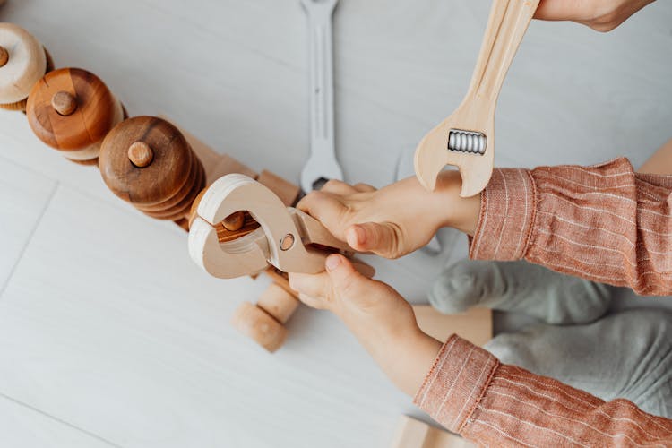 Child With Toy Blocks And Tools