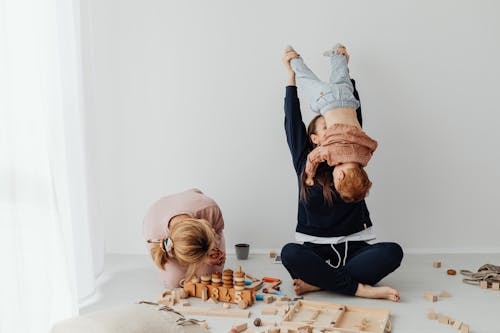 Free A Mother Lifting Her Child Stock Photo