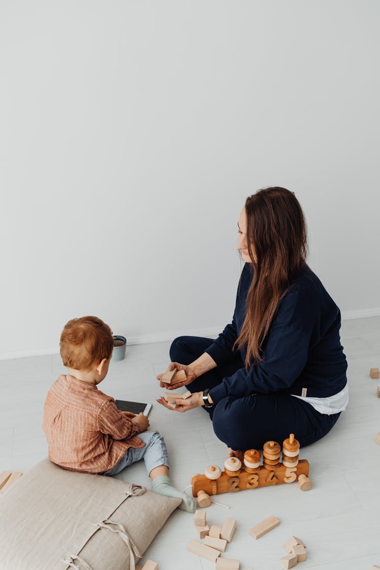 Mother And Son Using Educational Toys