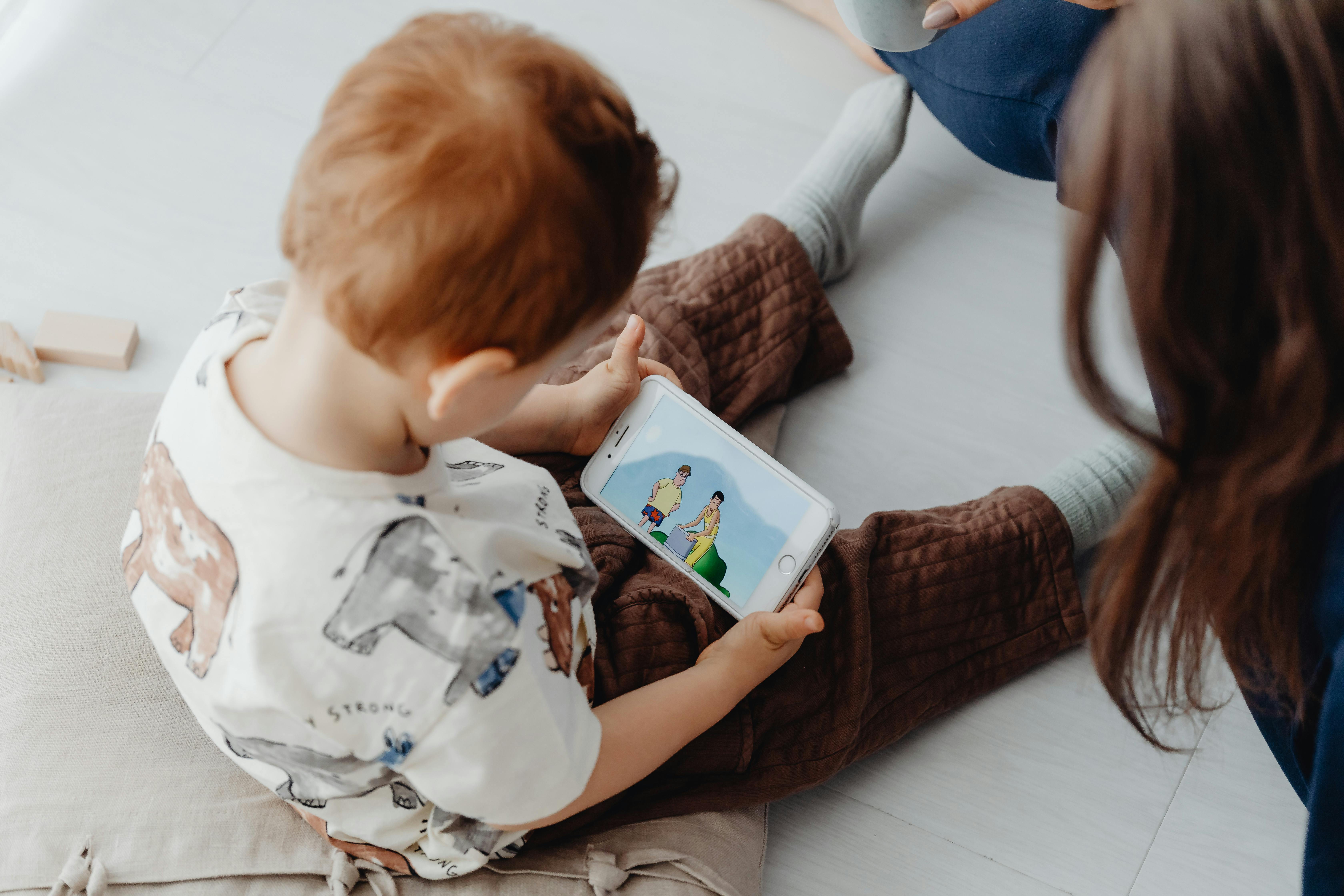 Child Watching Cartoon on Cellphone