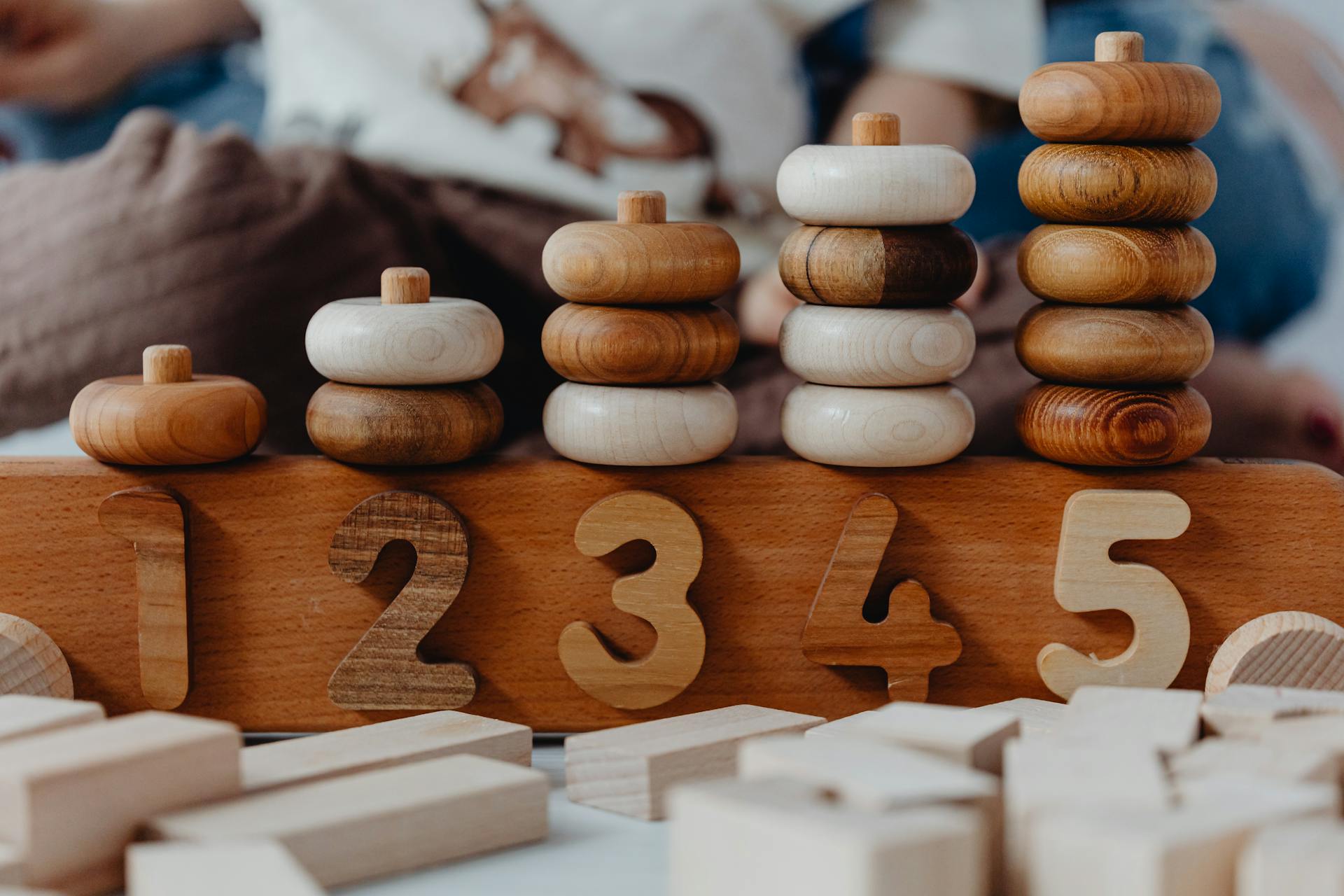 Close-up of wooden number stacking toy promoting creativity and learning in children.