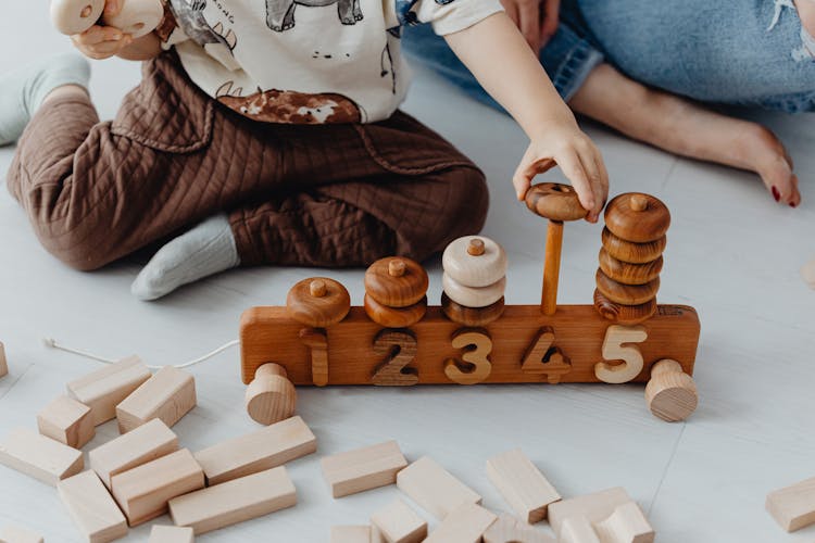 Child Playing With Toy Blocks