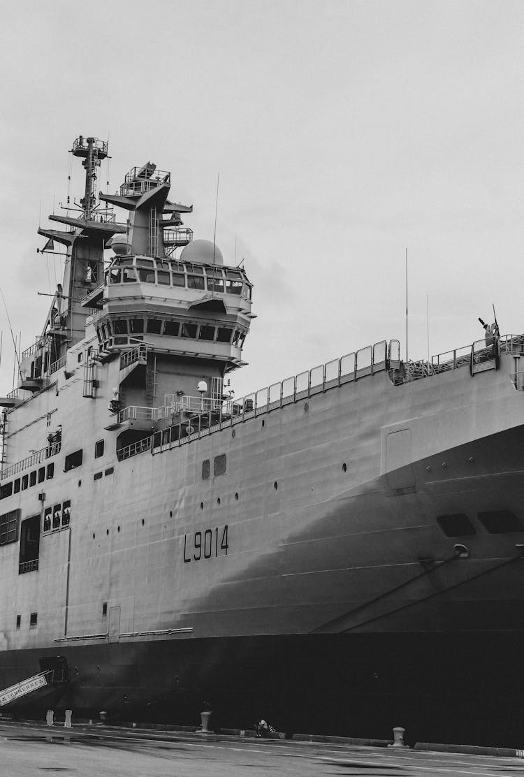 Large Military Ship In City Harbor