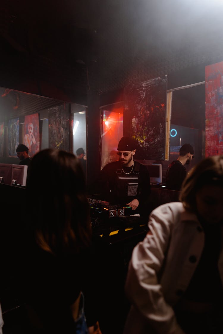 Photograph Of A Disc Jockey In A Club