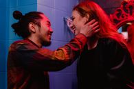 Man in Black Long Sleeve Shirt Holding Womans Face