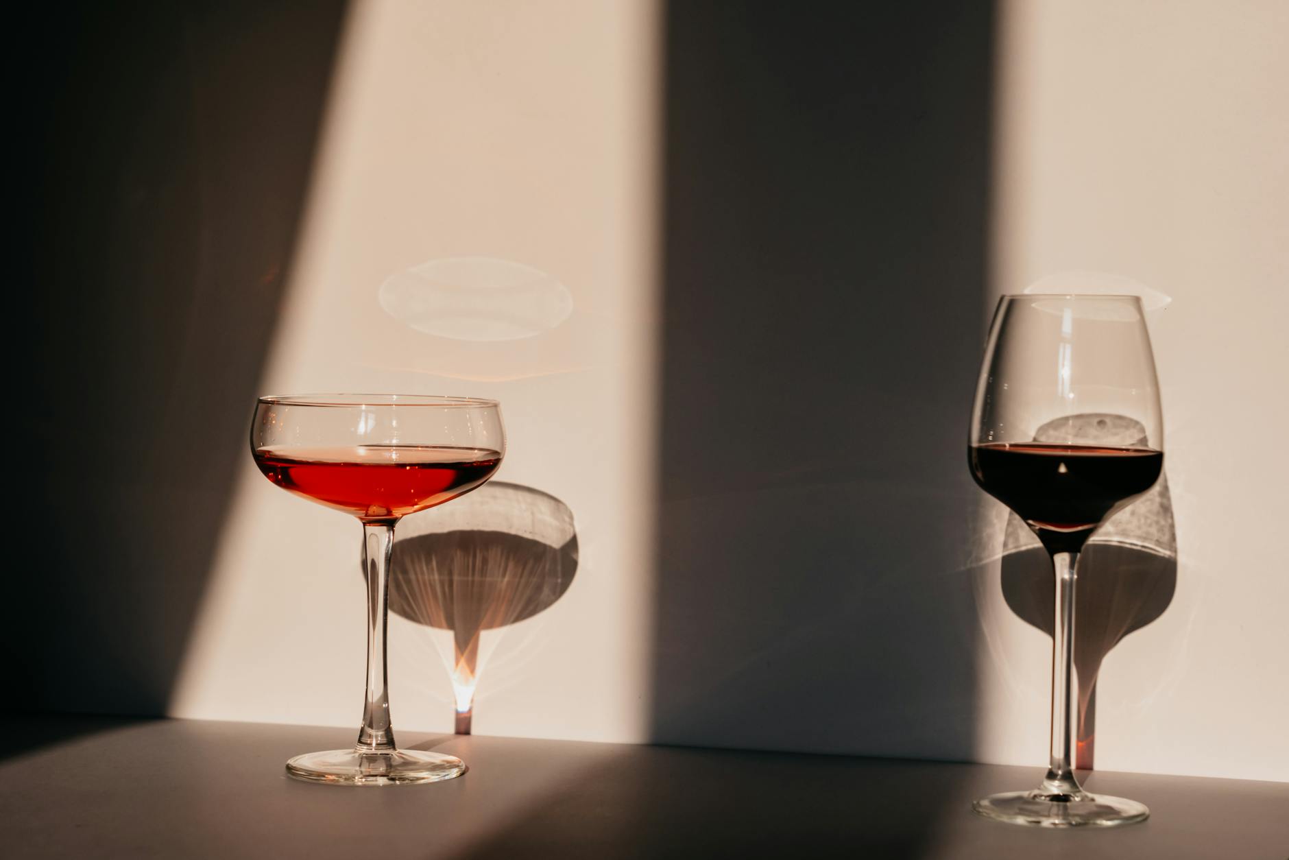 Red wine and vermouth in fragile glasses