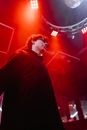 Man in Black Jacket Standing on Stage
