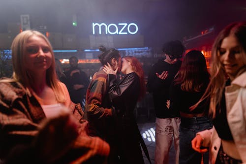 Man and Woman Kissing Inside the Night Club