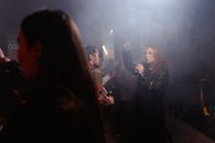 Crowd Drinking Beer Inside a Smokey Room