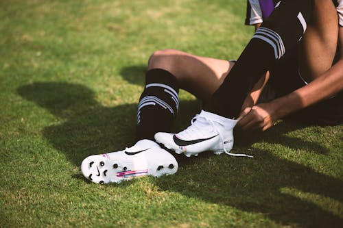 Free A Person Wearing Cleats Stock Photo