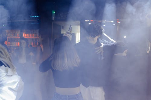 Man and Woman Partying Inside the Night Club