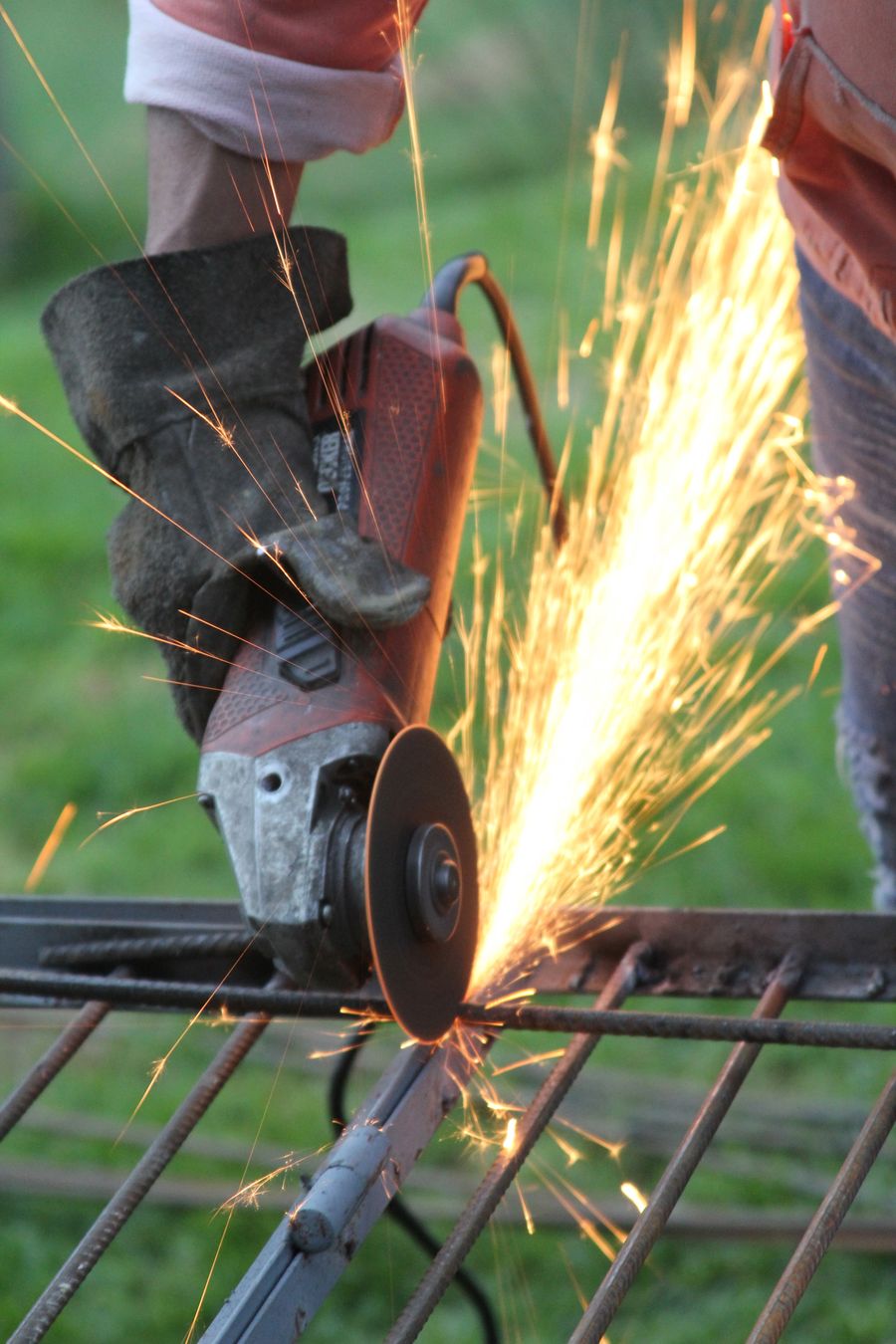 Metal worker shaping steel in a workshop