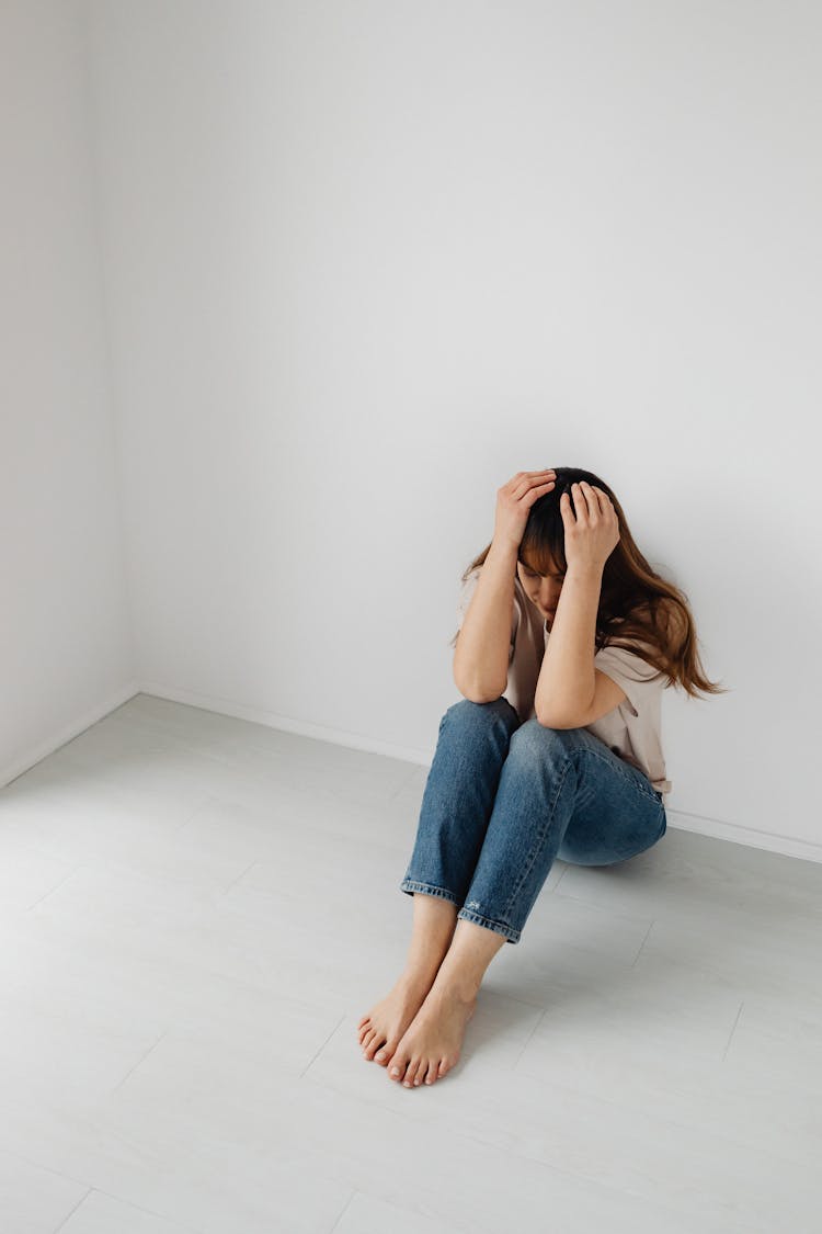 Sad Woman Sitting On Floor