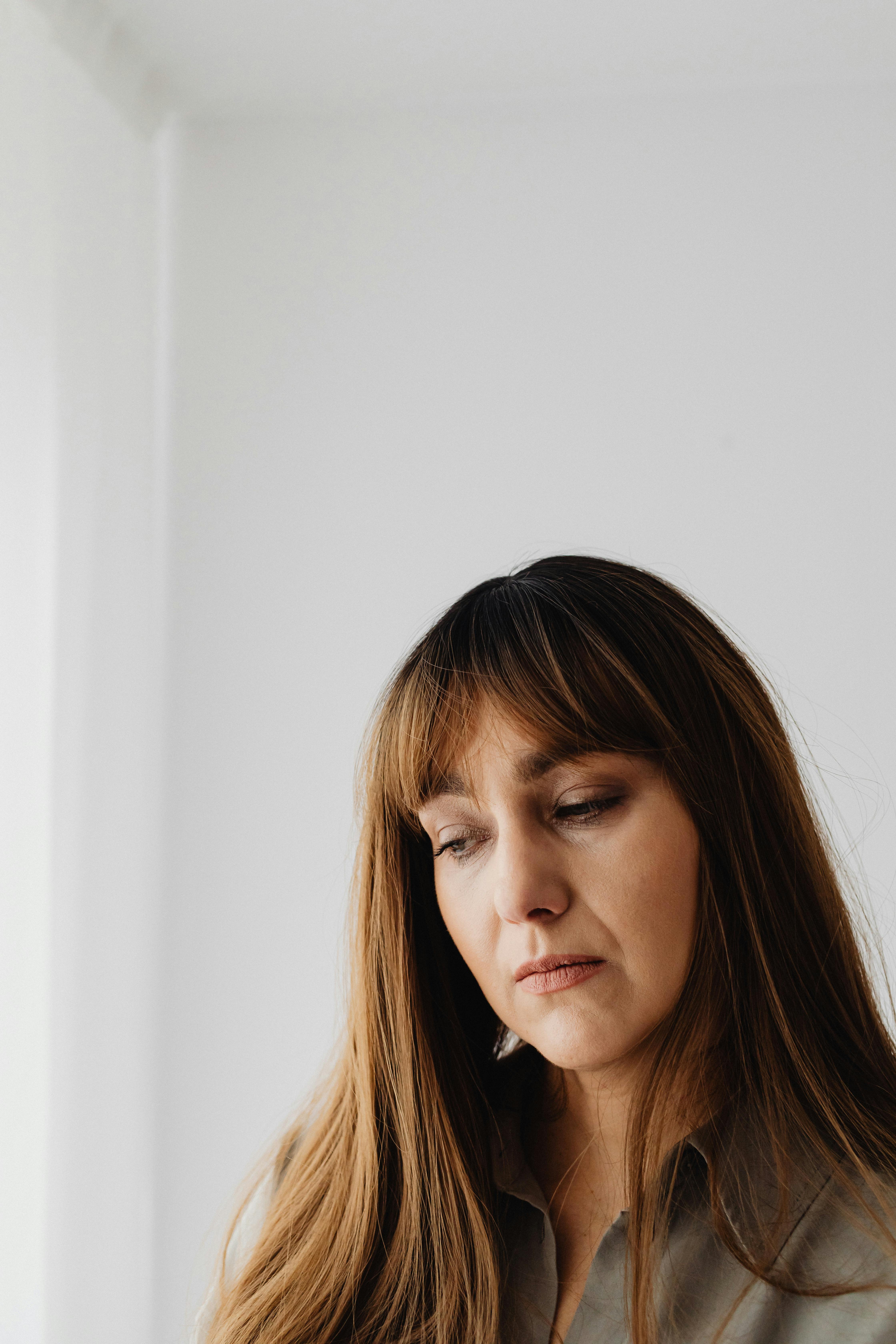 close up shot of a woman looking sad