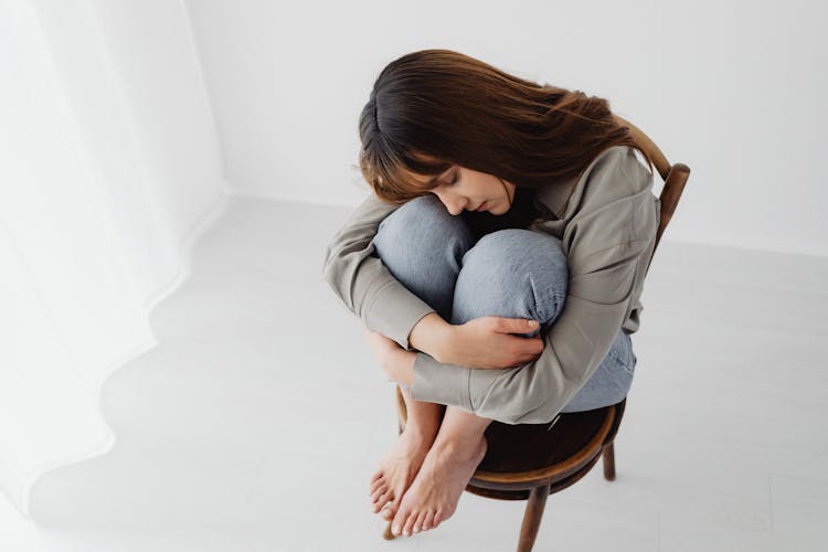 Woman Hugging Her Knees