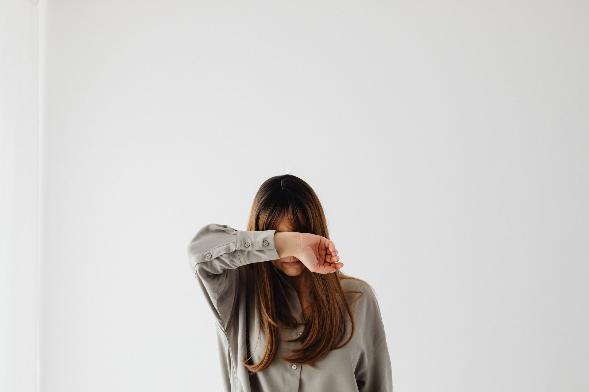 Portrait of a Woman Covering her Face with her Arm