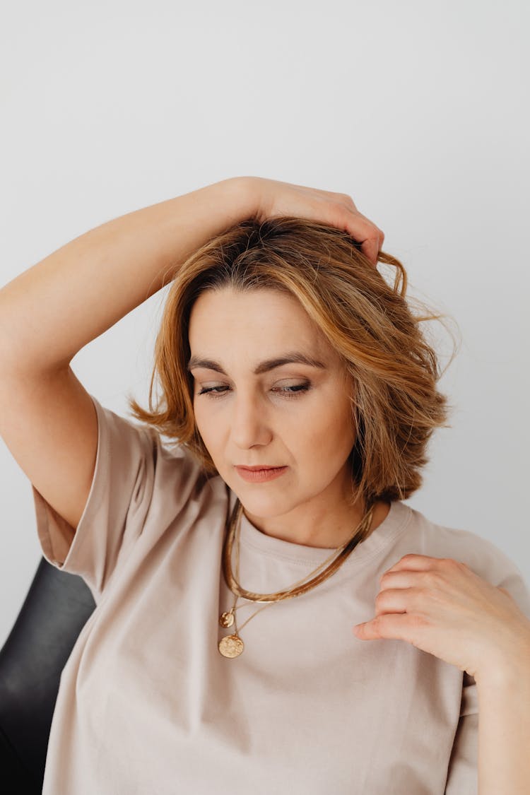 Portrait Of Woman Wearing Gold Neckla