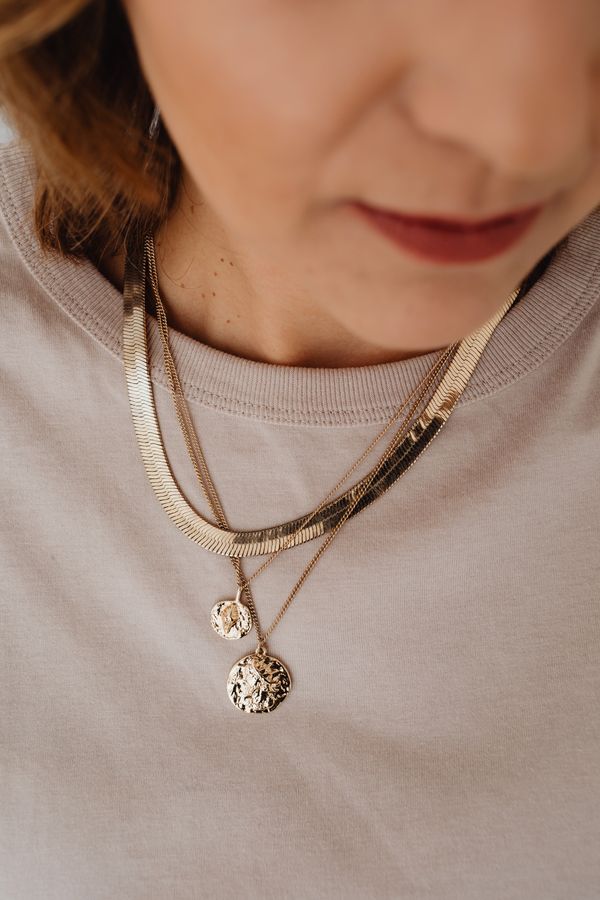 Layered beaded necklaces worn together