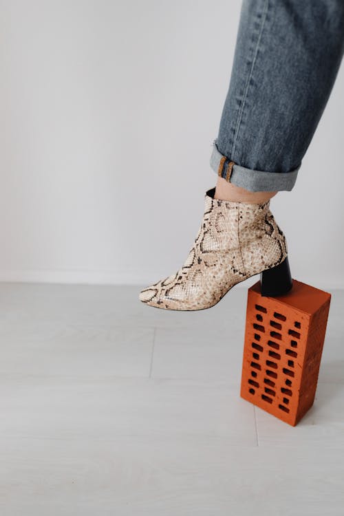 Free Close-Up Shot of a Person Wearing a Snakeskin Heels Stock Photo