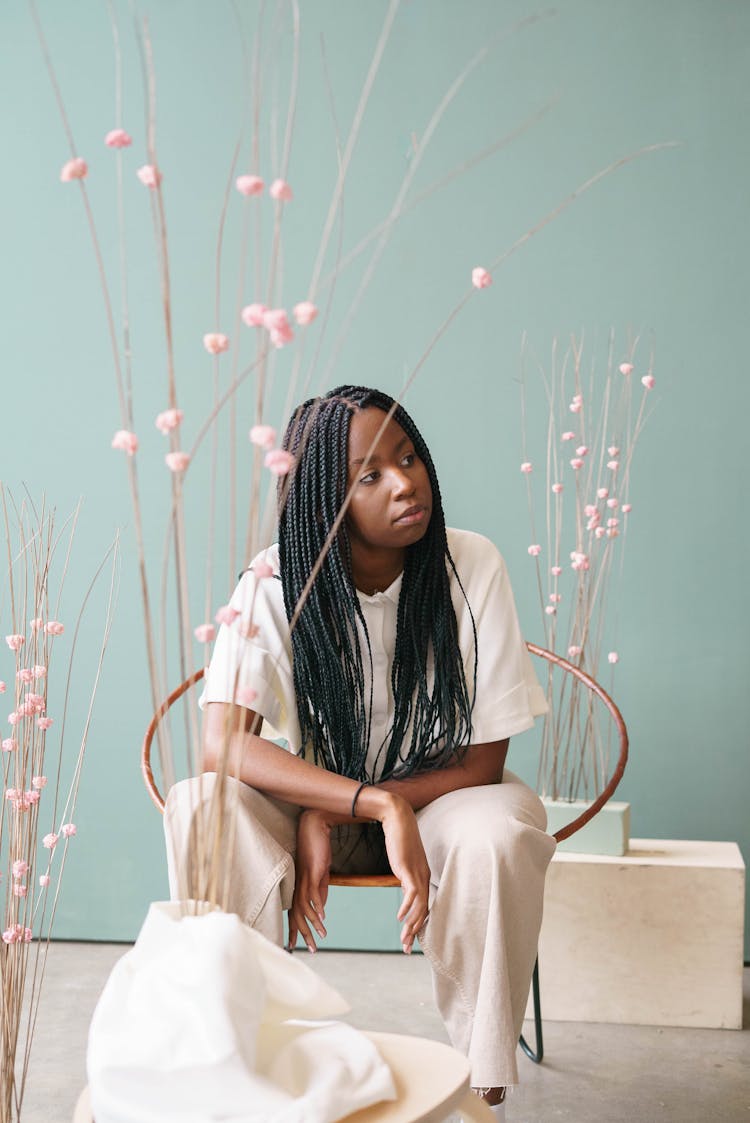 Young African American Woman Sitting On Chair