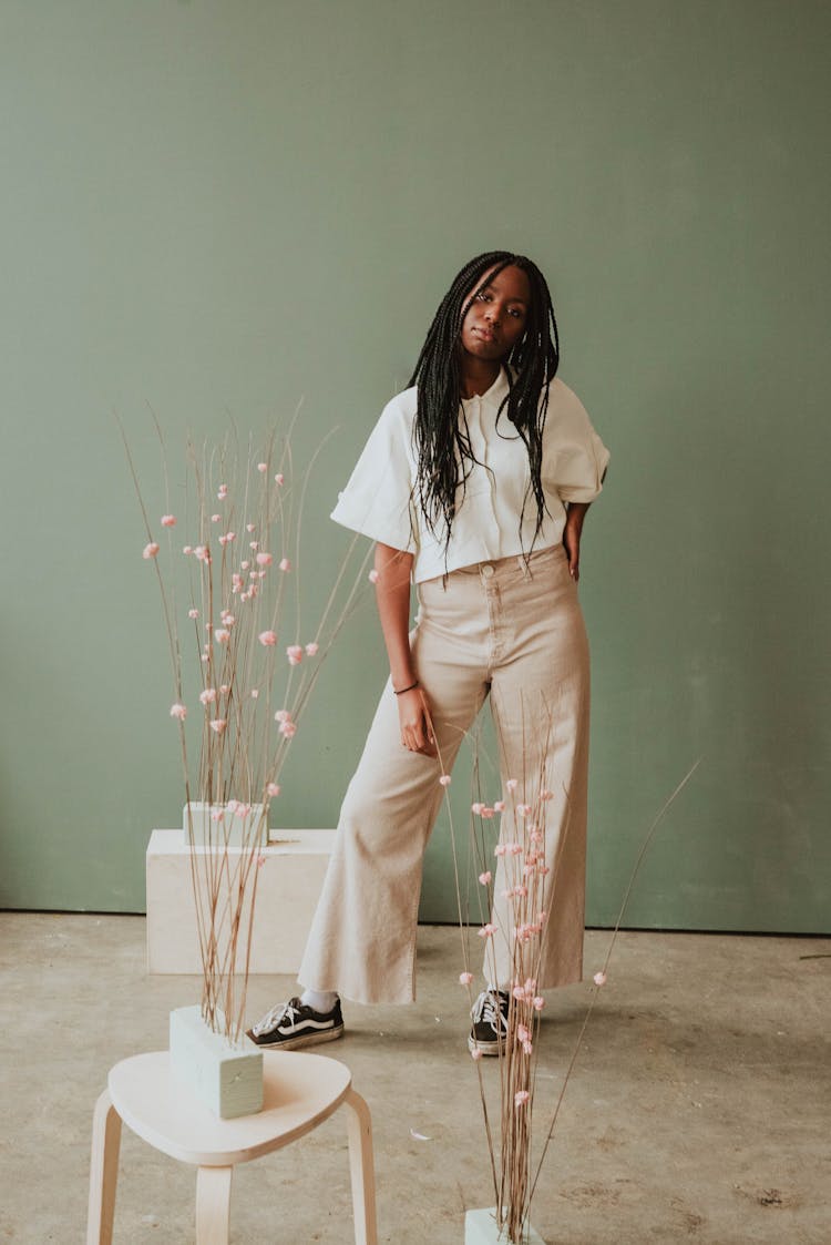 Stylish Black Woman Standing In Studio