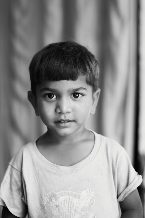 Grayscale Photo of a Boy