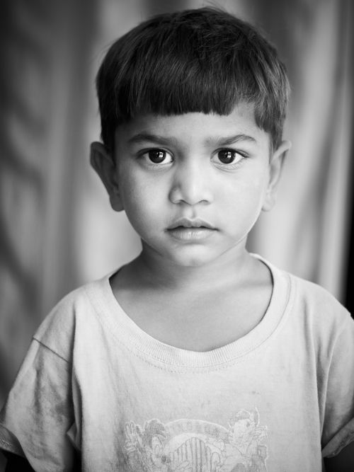 Free Black and white portrait capturing the innocence of a young child. Stock Photo