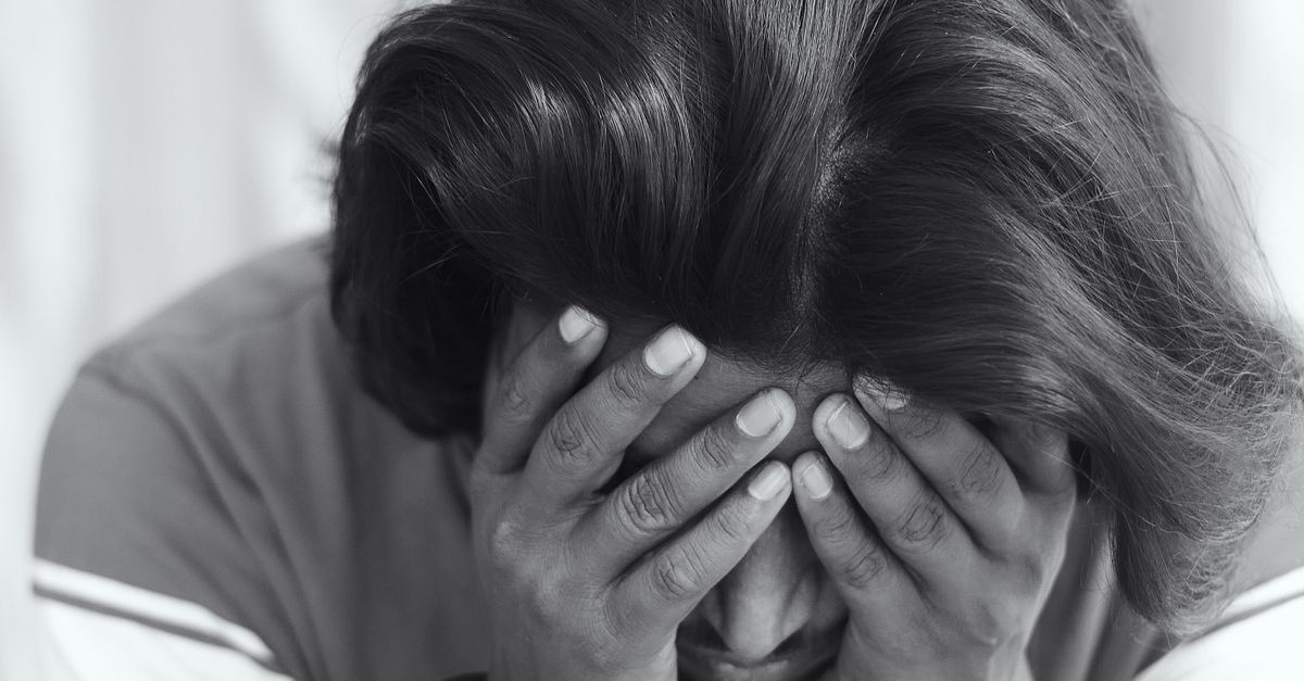 A Man Holding His Face · Free Stock Photo