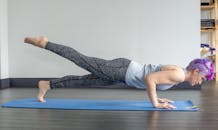 Woman in Gray Shirt and Leggings Doing Home Workout