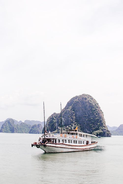 White Boat on Sea Near the Island