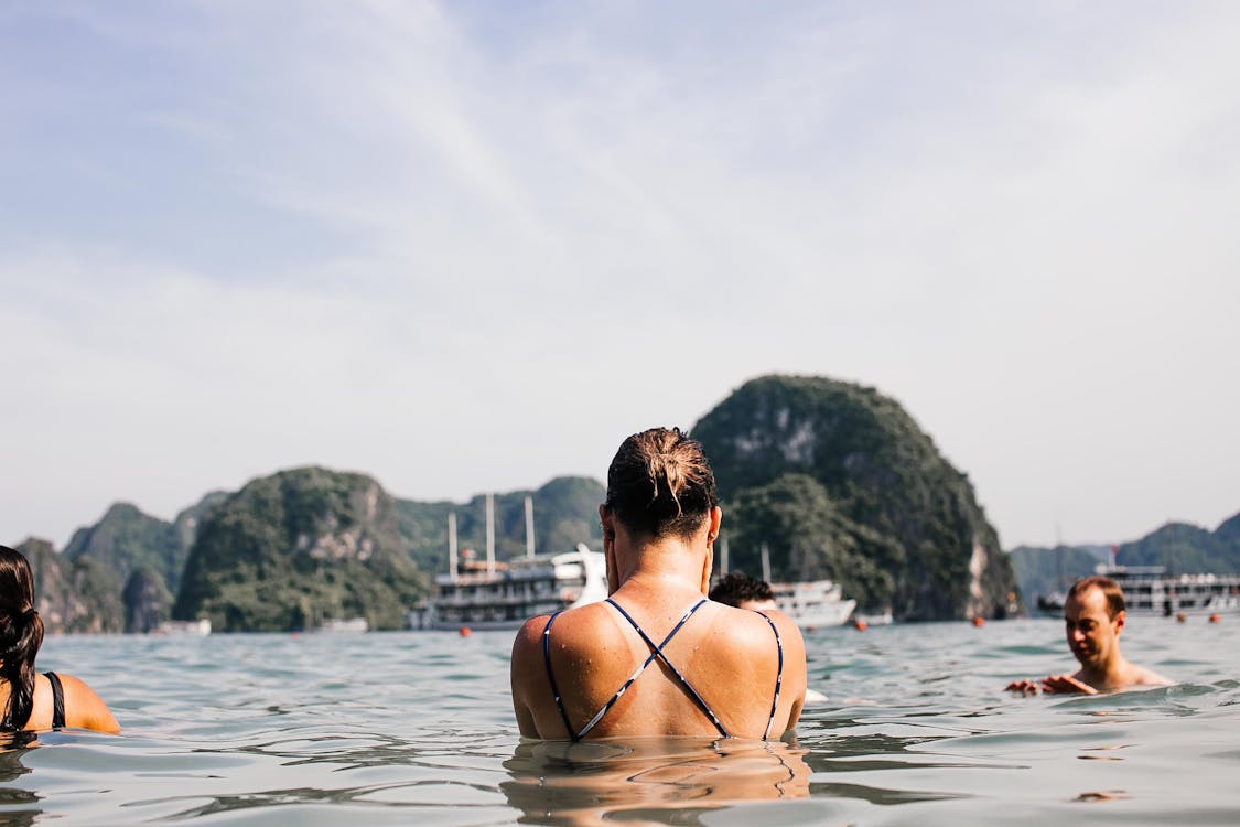 Swimming on the ocean in halong bay tour 