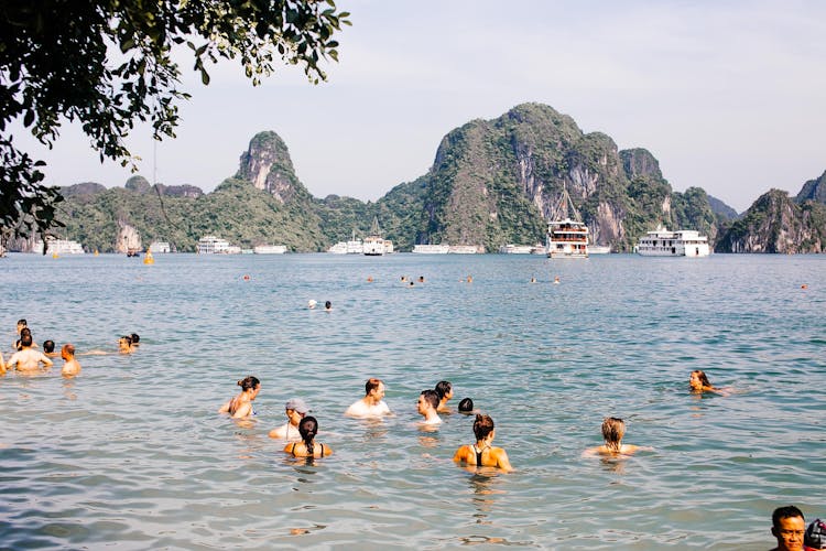 People Swimming In Ha Long Bay In Vietnam 