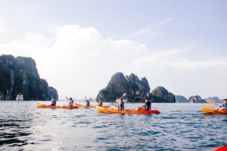 People Kayaking In Ha Long Bay In Vietnam 