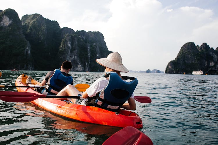 Men Riding A Kayak