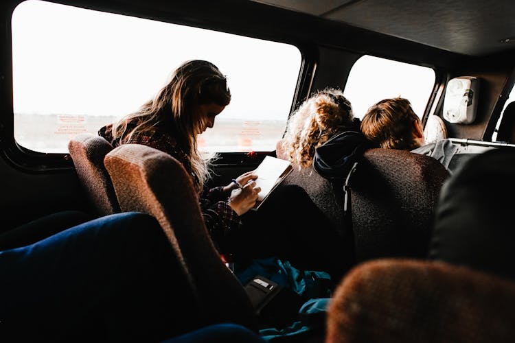 People Sitting In A Van