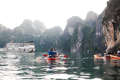 Free People Kayaking at Ha Long Bay Stock Photo