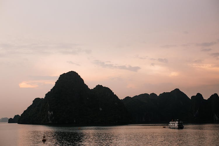 Silhouetted Cliffs In Ha Long Bay At Sunset 