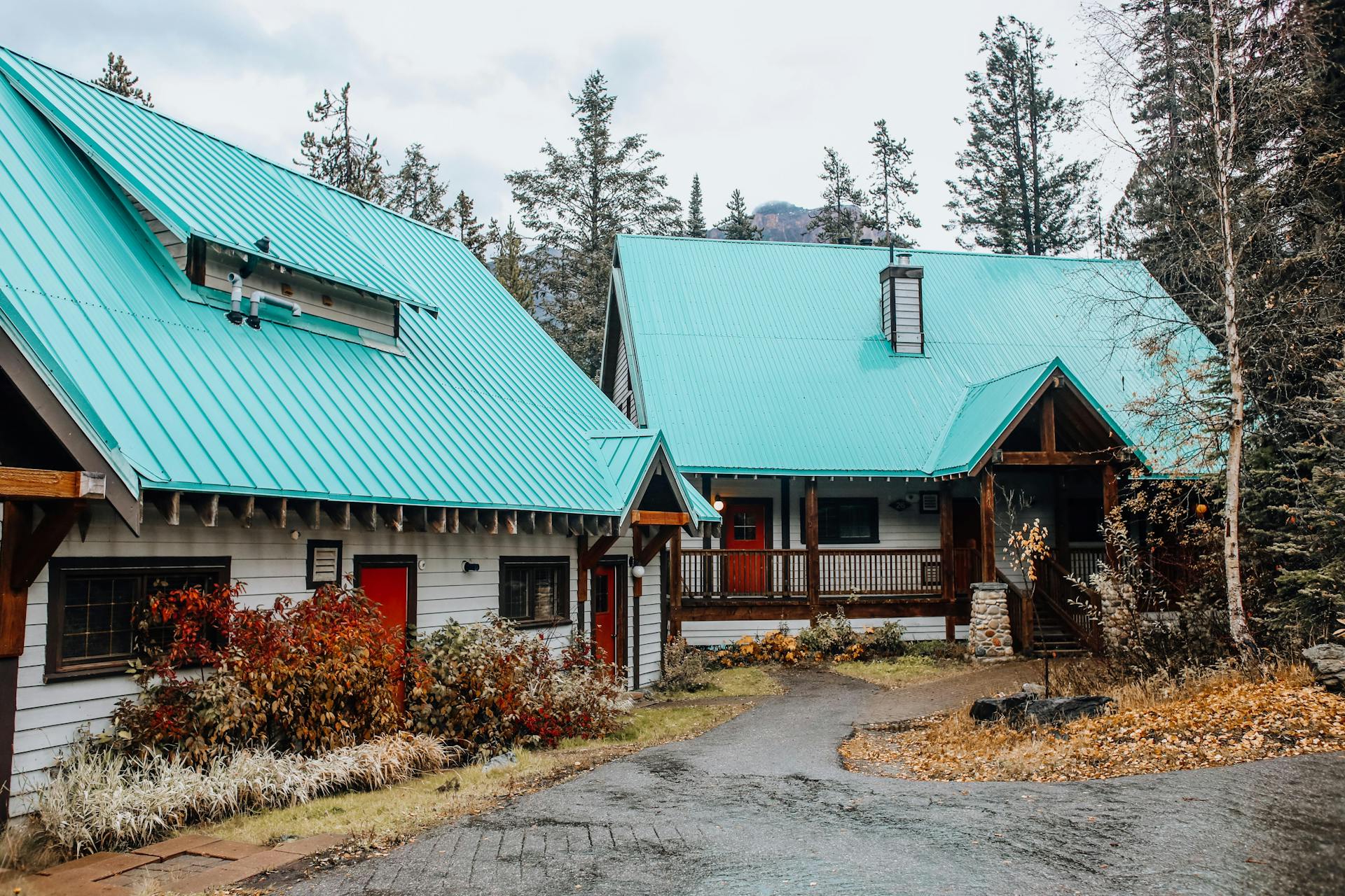 Two Chalets With Turquoise Roofs