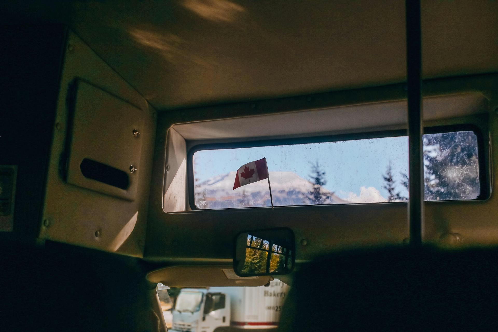 Canada Flag Near the Car Window